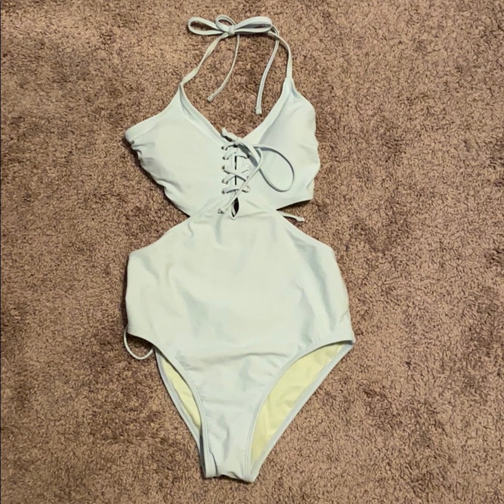 One piece with side cut out,halter top, open back